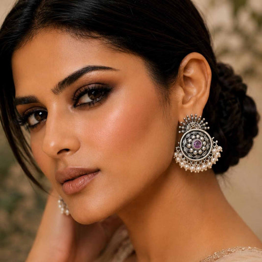 Woman wearing pearl German Silver floral chandbali earrings