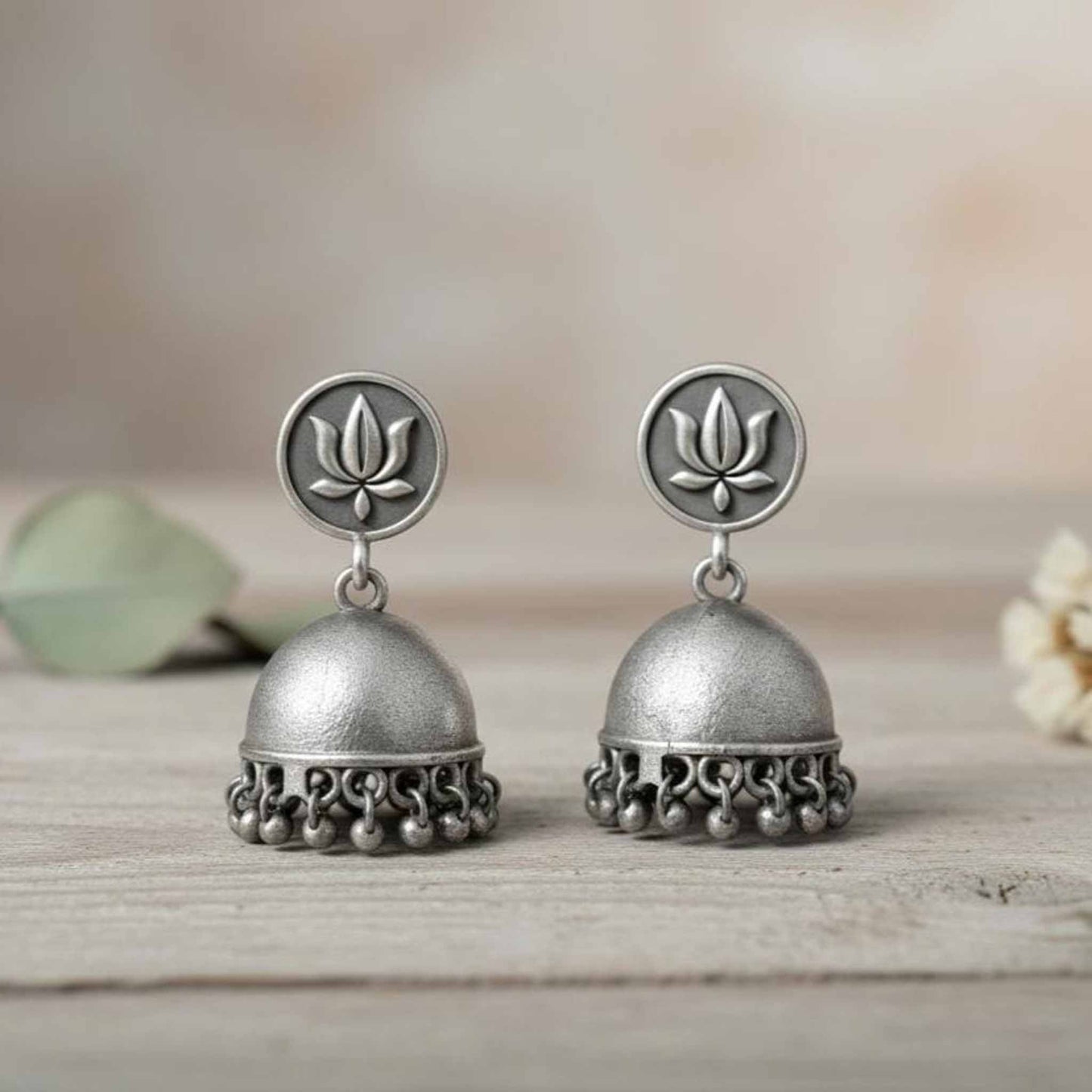 Lotus Motif German Silver Jhumka Earrings with Ghungroo Detailing