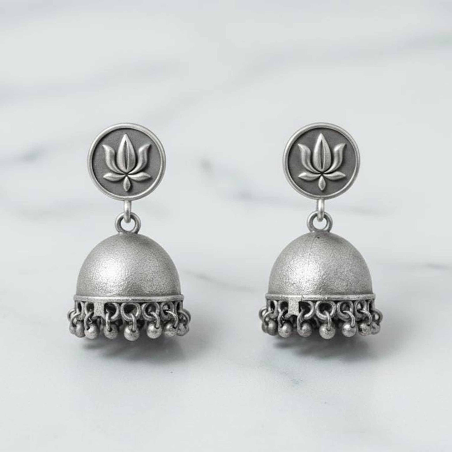 Lotus Motif German Silver Jhumka Earrings with Ghungroo Detailing