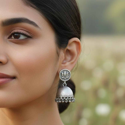Lotus Motif German Silver Jhumka Earrings with Ghungroo Detailing